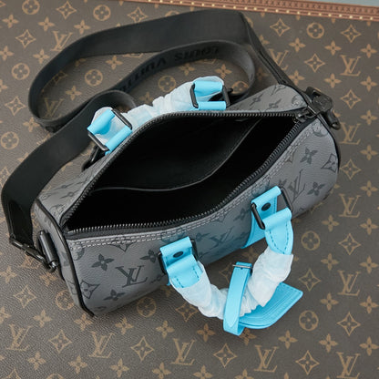 KEEPALL BANDOULIÈRE 25 IN GUN METAL MONOGRAM ECLIPSE CANVAS MIX TURQUOISE CALFSKIN